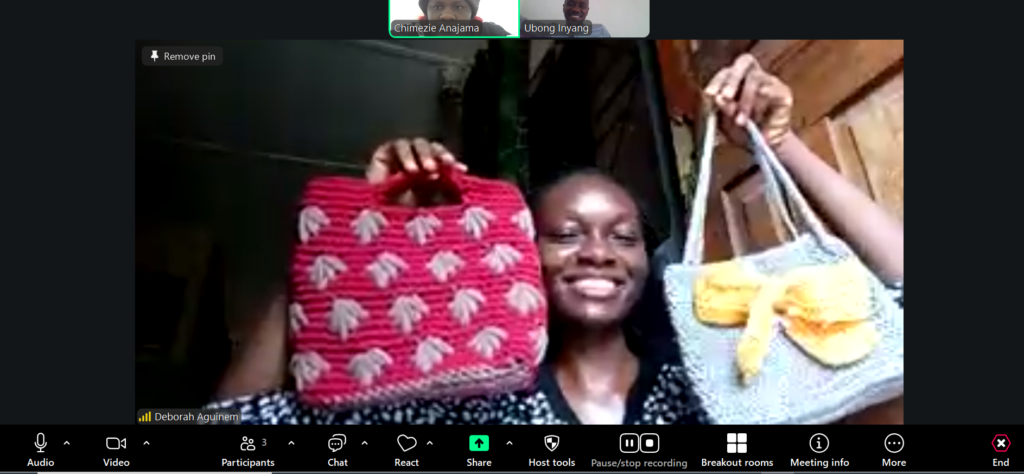 Deborah showcasing some of her crocheted products.